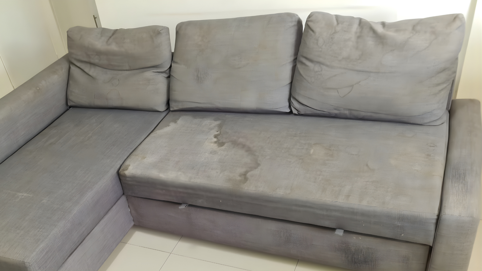 Heavily Soiled Couch with Stains Before Professional Cleaning